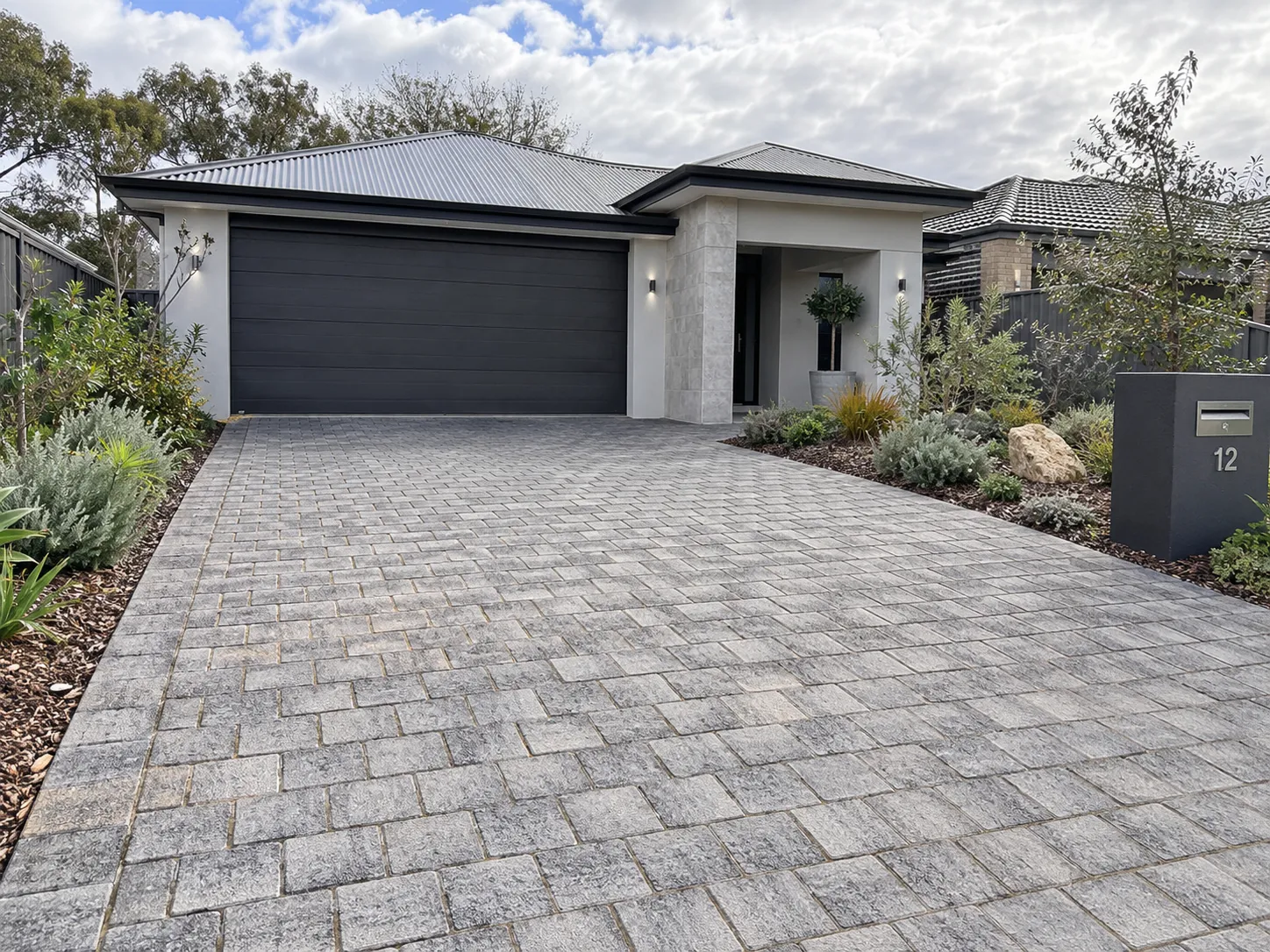 Permeable paver driveway leading to a residential garage in Sydney